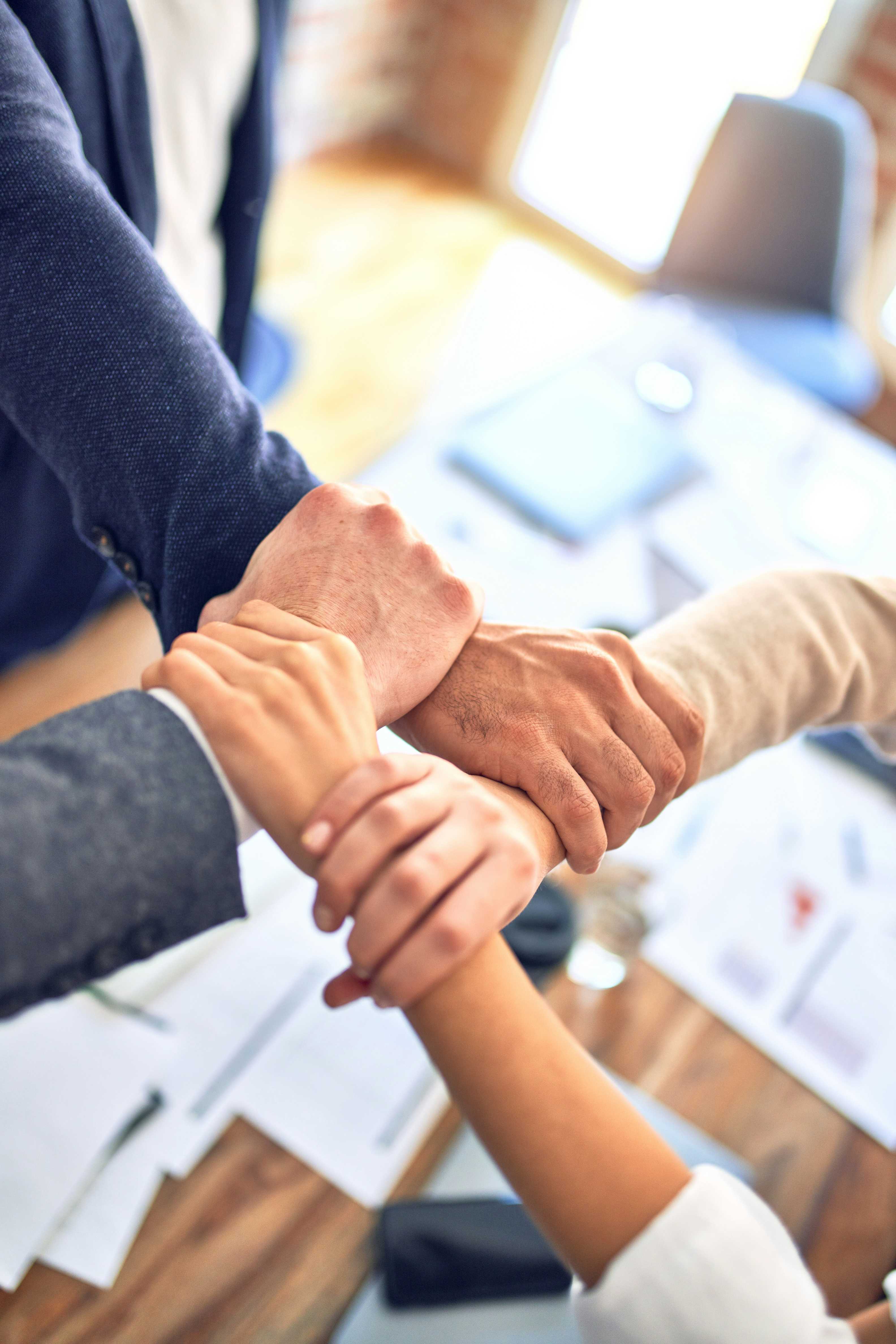 People joining hands together